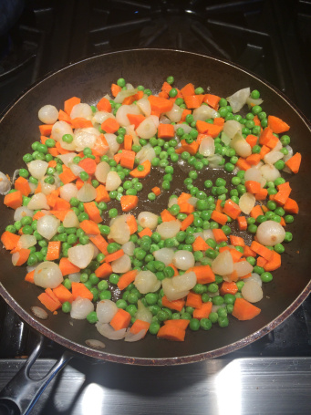 Once veggies are cooked, move to half the pan and add eggs and start to scrambled eggs. 